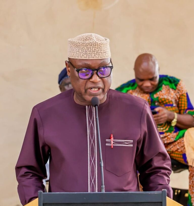a man standing at a podium