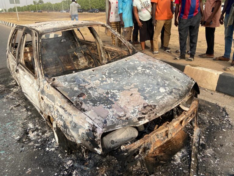 Abuja Mob Beat Two Suspected One-Chance Robbers To Death, Car Set Ablaze